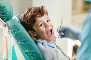 a child smiling at their dentist